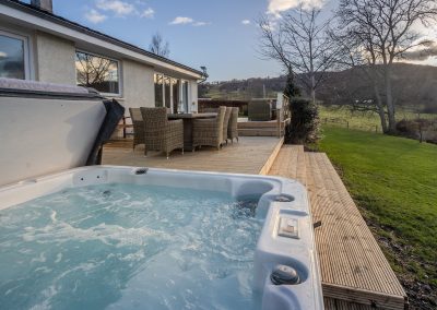 Ardeonaig Lodge, luxury holiday home, Loch Tay, Scotland with magnificent loch views and outdoor dining area and hot tub